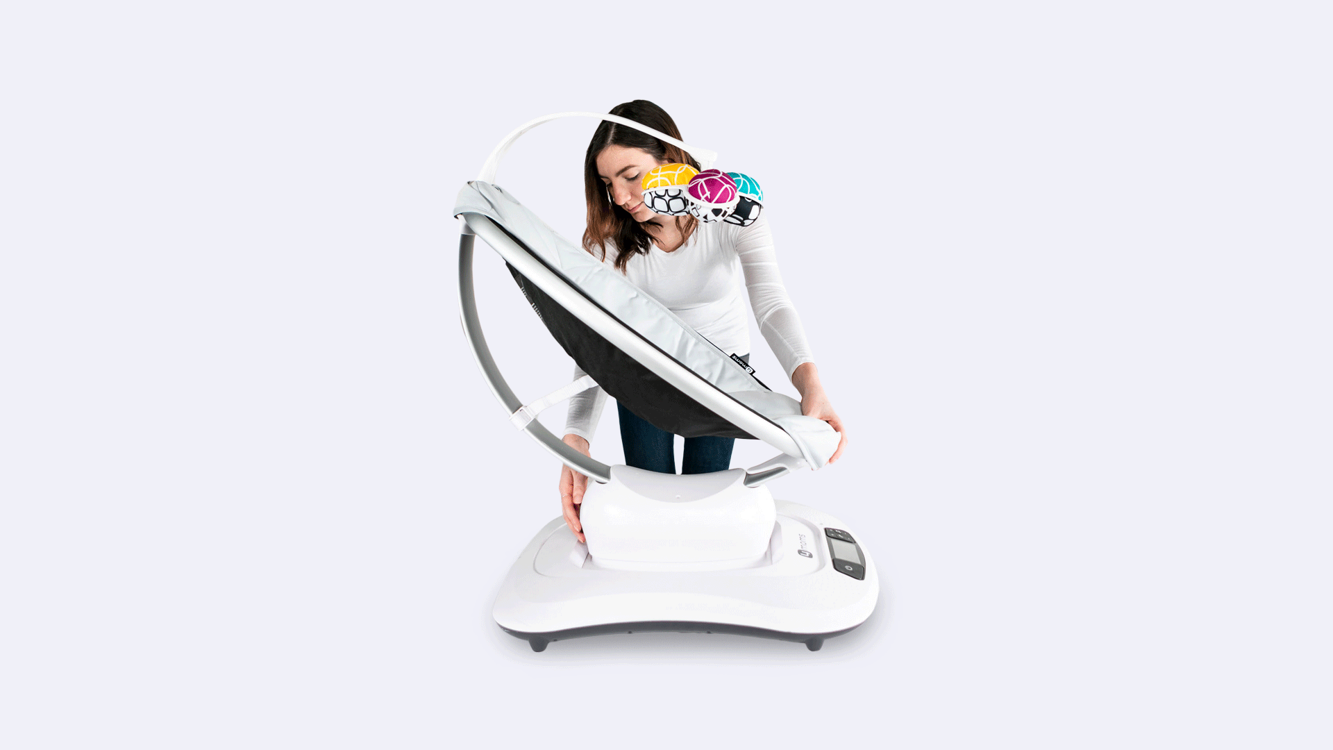 woman adjusting baby seat to full recline